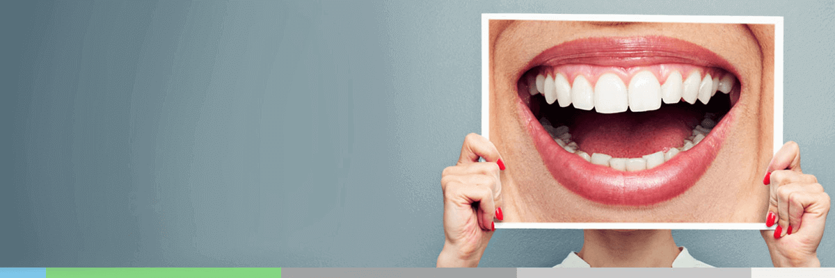 Happy patient showing beautiful smile after treatment